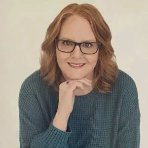 Professional portrait of a woman representing community engagement